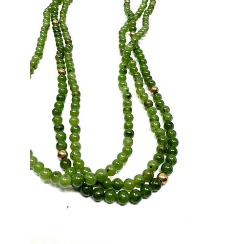 114 - 9ct gold clasp jade & gold bead 3 strand necklace weight 35g