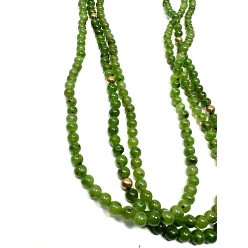 114 - 9ct gold clasp jade & gold bead 3 strand necklace weight 35g