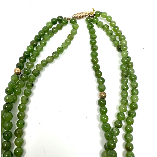 114 - 9ct gold clasp jade & gold bead 3 strand necklace weight 35g