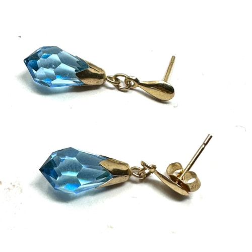 117 - 9ct gold blue faceted stone drop earrings