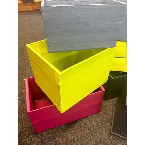 245 - Selection of coloured wooden boxes / crates, various sizes, largest measures approximately Width 21 ... 