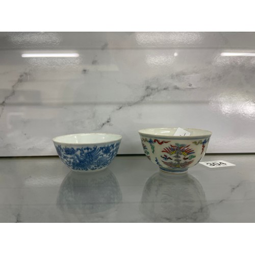 304 - Two oriental tea bowls with 6 character marks to bases overall measurements of largest 2 inches tall... 