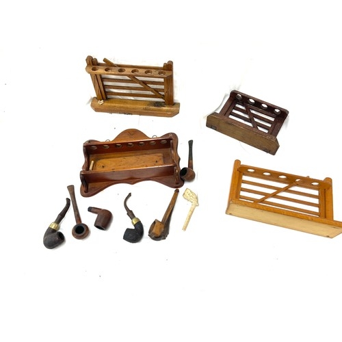 120 - Vintage wooden smking pipe stands and a selection of smoking pipes