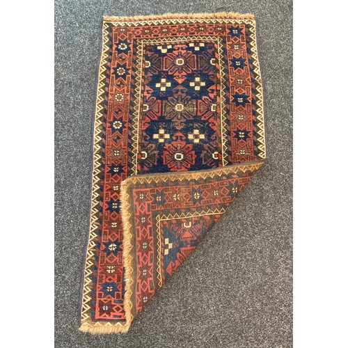 160 - Small rug measures approximately 48 inches long 27 inches wide