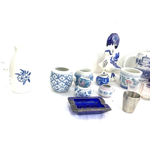 38 - Selection of oriental pottery includes candle stick etc