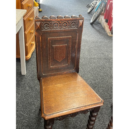 300 - Pair of antique carved hall chairs