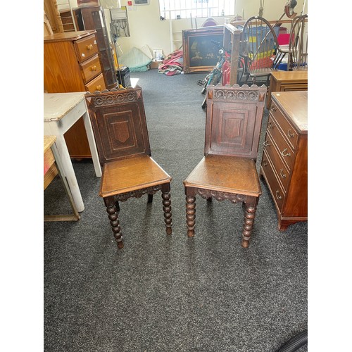 300 - Pair of antique carved hall chairs