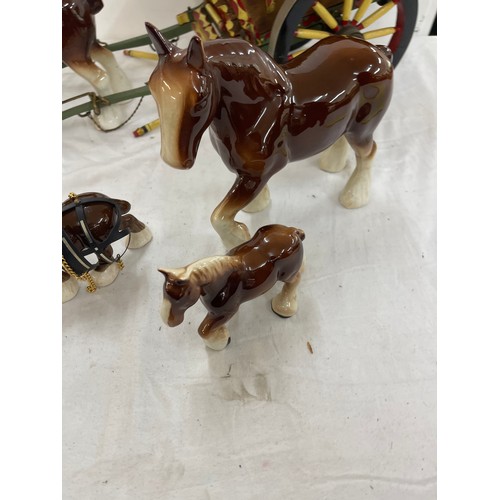 83 - Horse and trailer figure and a selection of pottery horses