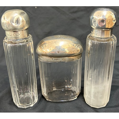 143 - 3 hallmarked Aspray silver topped glass bottles, dents and dinks to silver tops