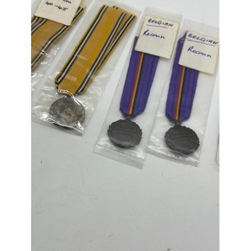 499 - Selection of 8 Belgian and Dutch Minitaure medals.  2 each of Belgian Cross des Evades, Reconnaissan... 