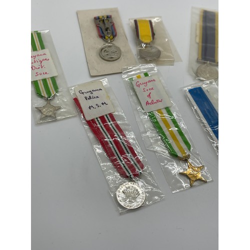 504 - Selection of 6 Brunei and 8 Guyana Miniature medals