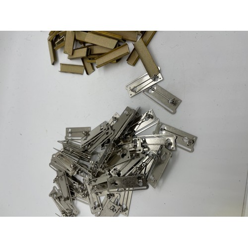 484 - Dealers lot of 50 single full size medal mounting bars plus approx. 100 medal ribbon mounting bars