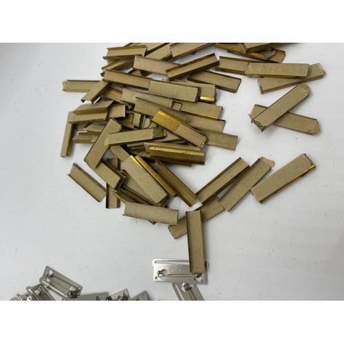 484 - Dealers lot of 50 single full size medal mounting bars plus approx. 100 medal ribbon mounting bars