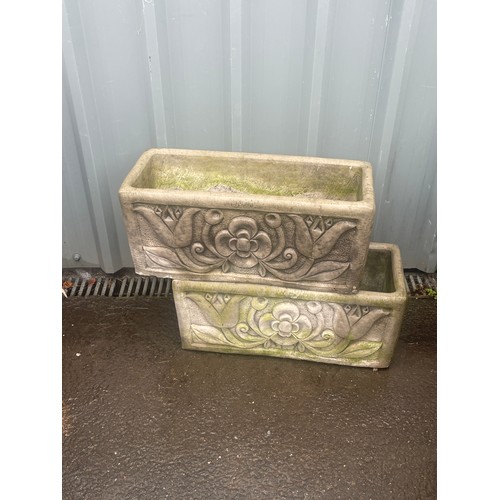 100X - 2 Concrete planters measures approximately 10 inches tall 23 inches wide 10 inches depth