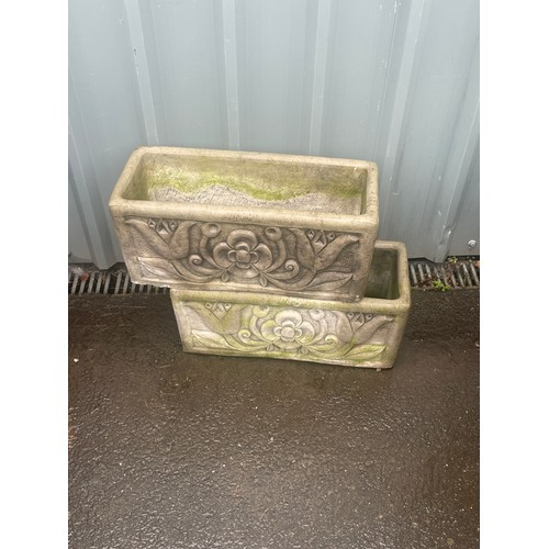 100X - 2 Concrete planters measures approximately 10 inches tall 23 inches wide 10 inches depth