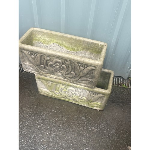 100X - 2 Concrete planters measures approximately 10 inches tall 23 inches wide 10 inches depth