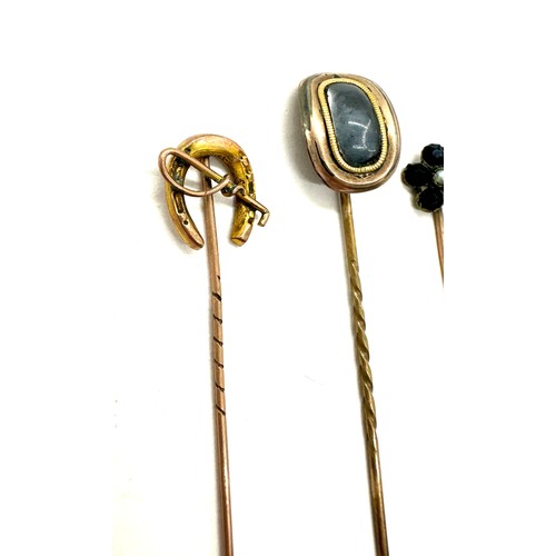 397 - Three vintage 9ct hold hat pins