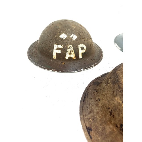 268 - 3 British military helmets to include a FAP field aid brodie helmet, 2 others