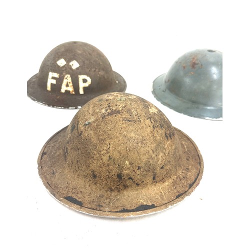 268 - 3 British military helmets to include a FAP field aid brodie helmet, 2 others