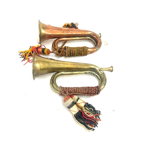 2 - British army Royal Artillery brass abd copper bugle with yellow, black and red cord tassel, together... 