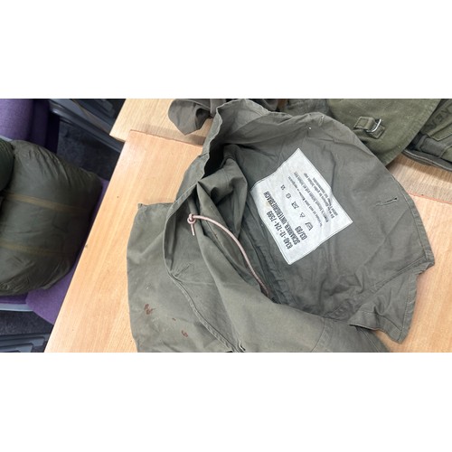 250 - Selection military issued gas masks, some with carry cases, flags, belts