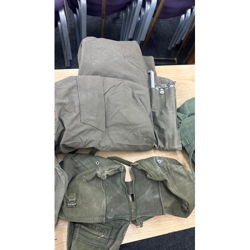 250 - Selection military issued gas masks, some with carry cases, flags, belts