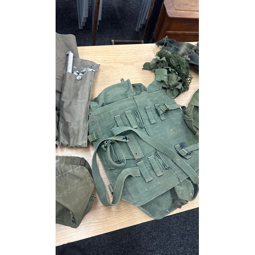 250 - Selection military issued gas masks, some with carry cases, flags, belts