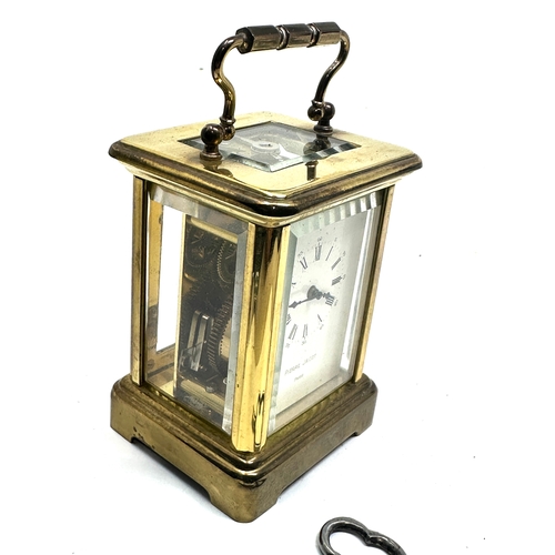 444 - Pierre jacot Paris carriage clock measures approx height 8cm by 5.7cm wide working order with key