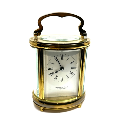 445 - Garrard & co Ltd brass carriage clock the clock is in working order measures approx 11cm high not in... 