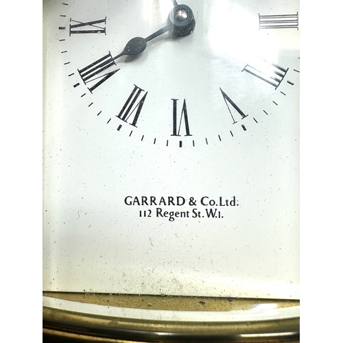 445 - Garrard & co Ltd brass carriage clock the clock is in working order measures approx 11cm high not in... 