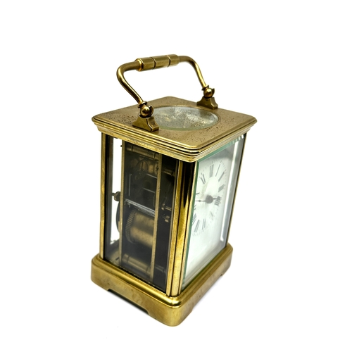 448 - Large brass striking carriage clock measures approx 13.2cm hight 8.3cm wide the clock is not ticking