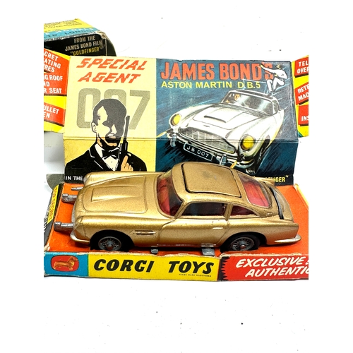 501 - Corgi 261 james bond aston martin d.b.5 boxed the box is in worn condition missing flaps