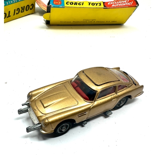 501 - Corgi 261 james bond aston martin d.b.5 boxed the box is in worn condition missing flaps