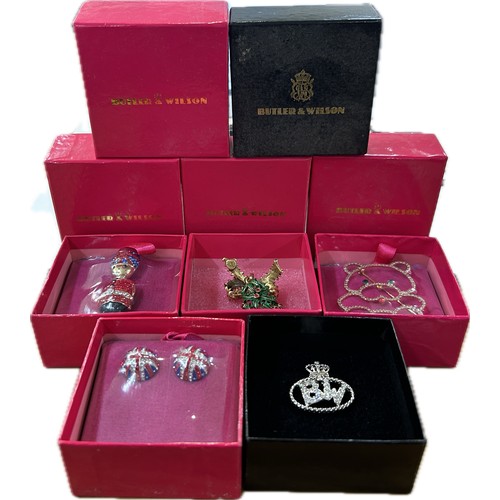 524 - Selection of 5 boxed Butler and Wilson pieces to include brooches/badges/ earrings