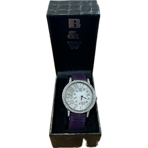 544 - Ladies stone set Butler and Wilson leather strap watch