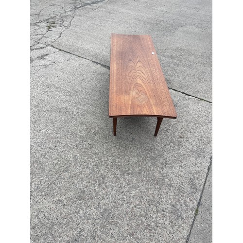 298 - 1960's teak coffee table with magazine rack measures approx 14 inches tall, 48 long and 16 deep