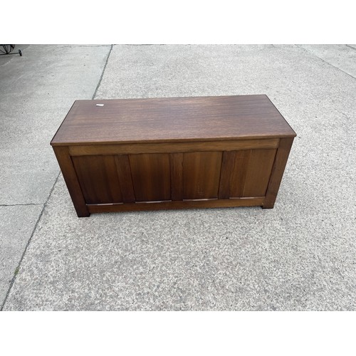 312 - Mahogany four panelled blanket/toy box measures approx 19 inches tall by 42 wide and 18 deep