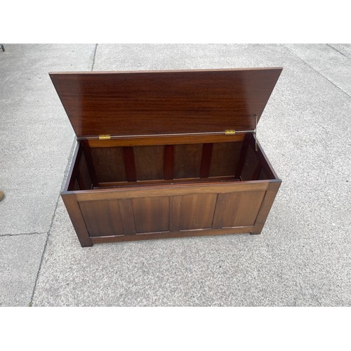 312 - Mahogany four panelled blanket/toy box measures approx 19 inches tall by 42 wide and 18 deep