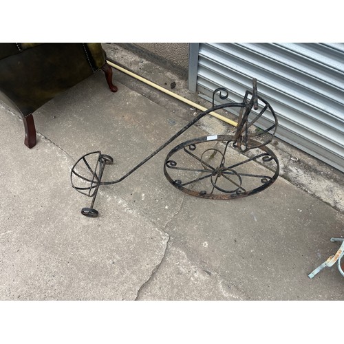 100K - Metal outdoor penny farthing planter measures approx 29 inches tall by 36 long