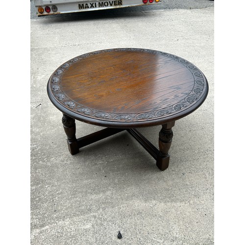 320 - Oak oversized carved top coffee table measures approx 18 inches tall, 40 diameter