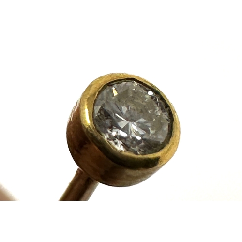 64 - Gold & diamond pin measures approx 4.2cm long diamond approx 3mm diameter weight .6g