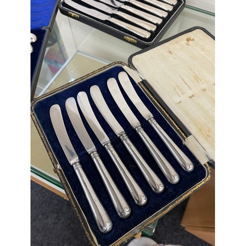 387 - 3 cased sets of silver handled butter knives