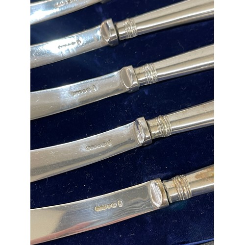 387 - 3 cased sets of silver handled butter knives