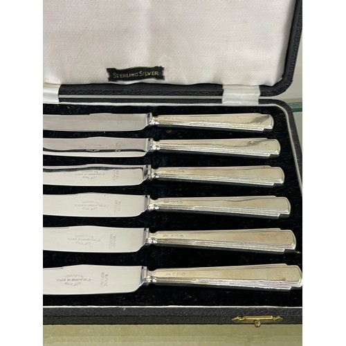 387 - 3 cased sets of silver handled butter knives