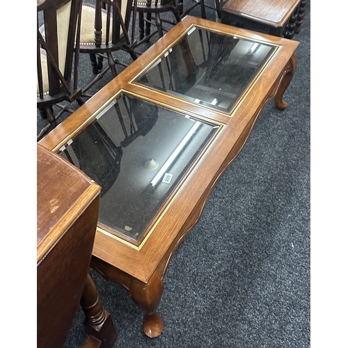 299 - Glass topped coffee table measures approximately