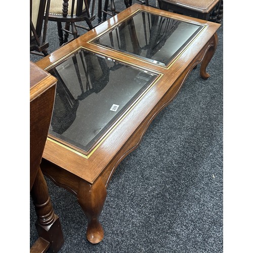 299 - Glass topped coffee table measures approximately