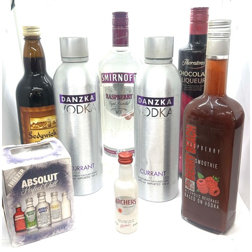 65 - Selection of sealed spirits to include Smirnoff Vodka, Absolut  etc