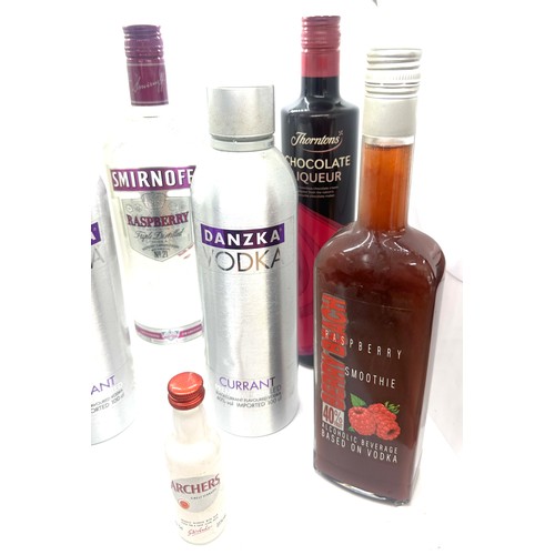 65 - Selection of sealed spirits to include Smirnoff Vodka, Absolut  etc