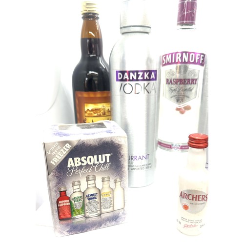 65 - Selection of sealed spirits to include Smirnoff Vodka, Absolut  etc