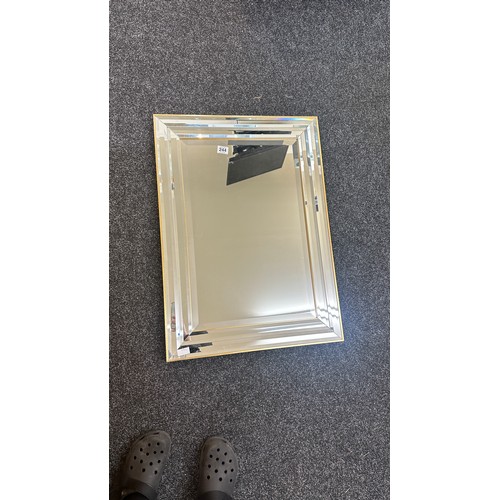 244 - Framed Mirror measures approximately 22 inches tall 23 inches wide